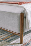 Lyncott Queen Upholstered Panel Bed